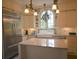 Bright kitchen boasting a stainless steel refrigerator, granite countertop, and farm sink at 219 Rigby St, Reevesville, SC 29471