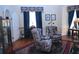 Charming living room with patterned armchairs, a fireplace, and elegant decor for comfortable and sophisticated living at 219 Rigby St, Reevesville, SC 29471
