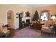 Elegant living room with classic furnishings, including a fireplace, grandfather clock, and plush seating at 219 Rigby St, Reevesville, SC 29471