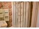 Shower with glass doors and vintage floral wallpaper in the bathroom at 219 Rigby St, Reevesville, SC 29471