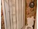 Shower with glass doors and vintage floral wallpaper in the bathroom at 219 Rigby St, Reevesville, SC 29471