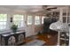 Inviting sunroom with lots of natural light, hardwood floors, and an antique chest at 219 Rigby St, Reevesville, SC 29471