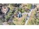 Aerial view of home showcasing landscaped grounds, circular driveway and surrounding greenery at 2224 Shoreline Dr, Johns Island, SC 29455