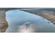 Stunning aerial view of a wide, tranquil river with adjacent marshlands and docks at 2224 Shoreline Dr, Johns Island, SC 29455