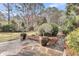 Gorgeous back patio with stone pavers, mature landscaping and exterior lighting at 2224 Shoreline Dr, Johns Island, SC 29455