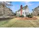 Spacious backyard featuring a gazebo, mature trees, and lush green grass at 2224 Shoreline Dr, Johns Island, SC 29455