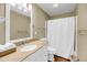 Well-lit bathroom featuring granite countertops, a white vanity, and a shower with a curtain at 2224 Shoreline Dr, Johns Island, SC 29455