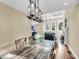 Open-concept dining room with hardwood floors and view of the living room at 2224 Shoreline Dr, Johns Island, SC 29455