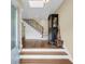 Entryway features hardwood floors and staircase with a modern railing design at 2224 Shoreline Dr, Johns Island, SC 29455