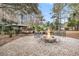 Backyard fire pit area with stone surround, seating, and lovely outdoor atmosphere at 2224 Shoreline Dr, Johns Island, SC 29455