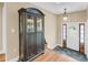 Inviting foyer with hardwood and tile flooring, a decorative cabinet, and a bright entryway at 2224 Shoreline Dr, Johns Island, SC 29455