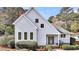 Charming home exterior with gray siding, decorative windows and lush landscaping for curb appeal at 2224 Shoreline Dr, Johns Island, SC 29455