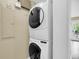 A convenient laundry room with a stacked washer and dryer for efficient space-saving at 2224 Shoreline Dr, Johns Island, SC 29455