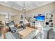 Open-concept living room with built-in shelving, fireplace, and hardwood floors at 2224 Shoreline Dr, Johns Island, SC 29455