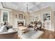 Spacious living room featuring a fireplace, coffered ceilings, and hardwood floors at 2224 Shoreline Dr, Johns Island, SC 29455