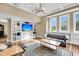 Open-concept living room featuring built-in shelving and large windows at 2224 Shoreline Dr, Johns Island, SC 29455
