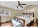 Comfortable main bedroom with hardwood floors, a ceiling fan, and large windows at 2224 Shoreline Dr, Johns Island, SC 29455