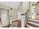 Second floor hallway featuring hardwood floors, a decorative rug, and craftsman trim at 2224 Shoreline Dr, Johns Island, SC 29455