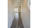 Clean, bright hallway with hardwood floors leading to a room with French doors and lots of natural light at 232 Buchanan Cir, Goose Creek, SC 29445