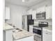 Kitchen featuring granite countertops, stainless steel appliances, and hardwood flooring at 232 Buchanan Cir, Goose Creek, SC 29445