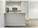 Modern kitchen features white cabinets, stainless steel appliances, and a breakfast bar at 232 Buchanan Cir, Goose Creek, SC 29445