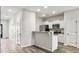 Modern kitchen with white cabinets, stainless steel appliances, and a breakfast bar at 232 Buchanan Cir, Goose Creek, SC 29445