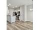 Open-concept layout with wood flooring connecting the kitchen and living area at 232 Buchanan Cir, Goose Creek, SC 29445