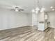 Bright living room features wood flooring, ceiling fan, and chandelier at 232 Buchanan Cir, Goose Creek, SC 29445