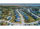 Aerial view of a vibrant neighborhood featuring colorful homes and beautiful lakes at 2461 Lieutenant Dozier Dr, Johns Island, SC 29455