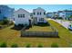 Aerial view of the backyard of a home, showcasing the lawn and fence at 2461 Lieutenant Dozier Dr, Johns Island, SC 29455