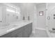 Bright bathroom featuring double sinks, a shower, and plenty of counter space at 2461 Lieutenant Dozier Dr, Johns Island, SC 29455