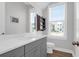 Bathroom features vanity with quartz countertops, gray cabinets and modern fixtures at 2461 Lieutenant Dozier Dr, Johns Island, SC 29455