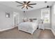 Bright bedroom featuring a large window, wood floors, and a comfortable bed with storage at 2461 Lieutenant Dozier Dr, Johns Island, SC 29455
