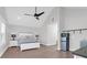 Bedroom with gray walls, wood floors, white trim, a ceiling fan, and a small kitchenette at 2461 Lieutenant Dozier Dr, Johns Island, SC 29455