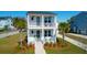 Charming two-story home with double porches, palm trees, and manicured landscaping at 2461 Lieutenant Dozier Dr, Johns Island, SC 29455