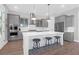 Modern kitchen featuring gray cabinets, a large island with seating, and stainless steel appliances at 2461 Lieutenant Dozier Dr, Johns Island, SC 29455