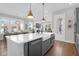 Island with quartz countertops, a modern sink, and view to the living room at 2461 Lieutenant Dozier Dr, Johns Island, SC 29455