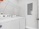 Modern laundry room featuring white washer and dryer units at 2461 Lieutenant Dozier Dr, Johns Island, SC 29455