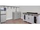 Living area with sink, microwave, stainless steel fridge, cabinet, and a wooden TV console at 2461 Lieutenant Dozier Dr, Johns Island, SC 29455