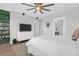 Spacious main bedroom featuring a ceiling fan and two entryways at 2461 Lieutenant Dozier Dr, Johns Island, SC 29455