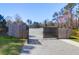 Community parking lot with gated entry next to a wooden fence at 2461 Lieutenant Dozier Dr, Johns Island, SC 29455