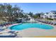 Resort style community pool with lounge chairs, pool house and lush landscaping at 2461 Lieutenant Dozier Dr, Johns Island, SC 29455