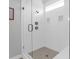 Modern tiled shower with glass door and built-in shelving at 2461 Lieutenant Dozier Dr, Johns Island, SC 29455