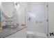 Chic bathroom with a glass vessel sink, granite countertops, a white vanity, and a glass-enclosed shower at 2515 Cat Tail Pond Rd, Seabrook Island, SC 29455