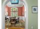 Formal dining room featuring an elegant chandelier, a table set for six, and a decorative rug at 2515 Cat Tail Pond Rd, Seabrook Island, SC 29455