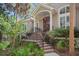 Inviting entrance with brick steps leading to a wood door at 2515 Cat Tail Pond Rd, Seabrook Island, SC 29455