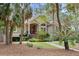 Beautifully appointed home with custom wood door, and manicured landscaping at 2515 Cat Tail Pond Rd, Seabrook Island, SC 29455