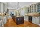 Spacious kitchen featuring an island with seating, stainless steel appliances, and custom cabinets at 2515 Cat Tail Pond Rd, Seabrook Island, SC 29455