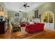 Spacious living room with high ceilings, a fireplace, large windows, and an elegant area rug at 2515 Cat Tail Pond Rd, Seabrook Island, SC 29455