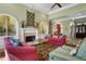 Bright living room featuring a fireplace, custom built-ins, comfortable seating, and a decorative area rug at 2515 Cat Tail Pond Rd, Seabrook Island, SC 29455